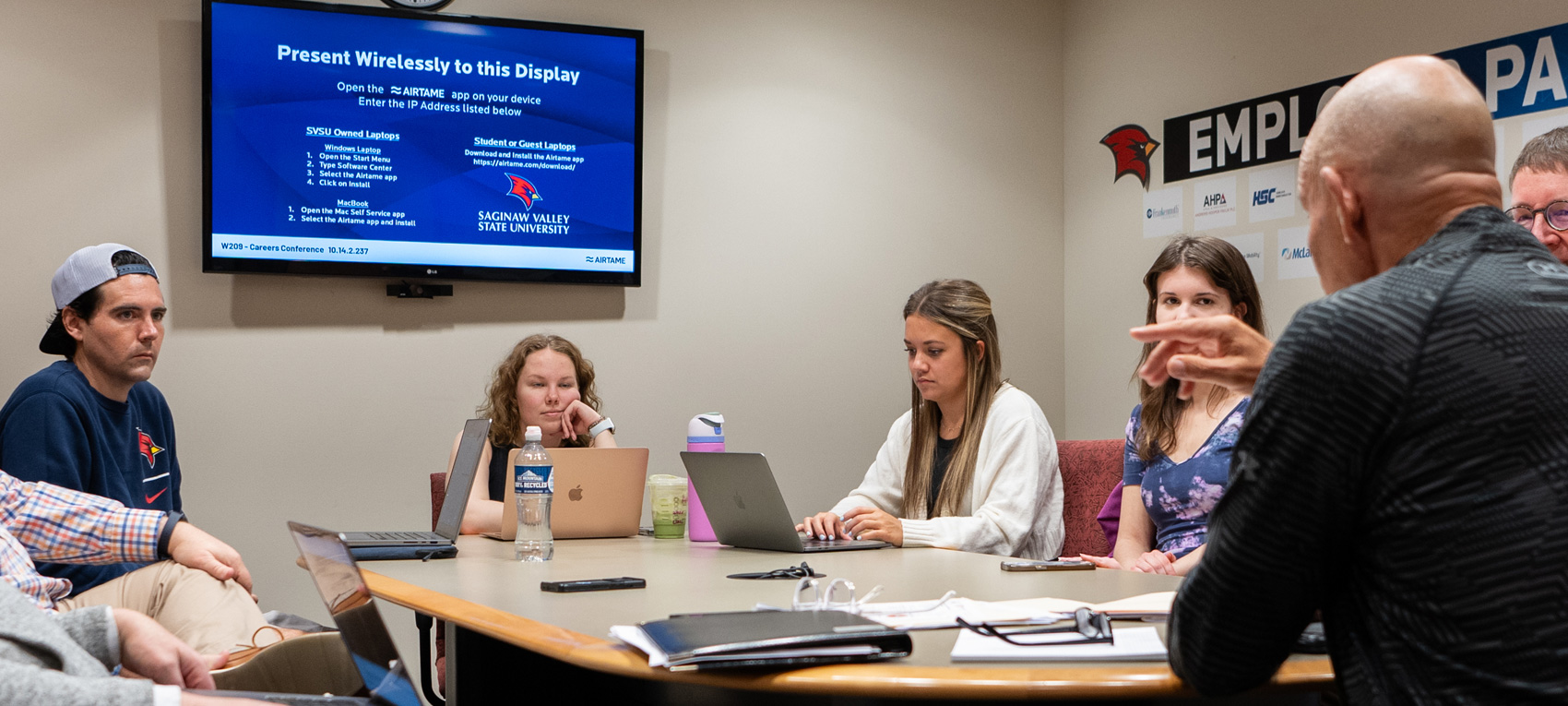 Photo: students and clients working on the HSC campaign